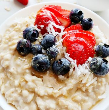 Cooked oatmeal with blueberries and strawberries.