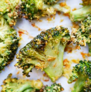 Roasted broccoli on a pan.