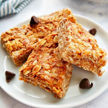 Granola bars with chocolate chips on a plate.