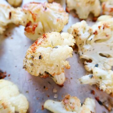 Close up of cauliflower on roasting pan.