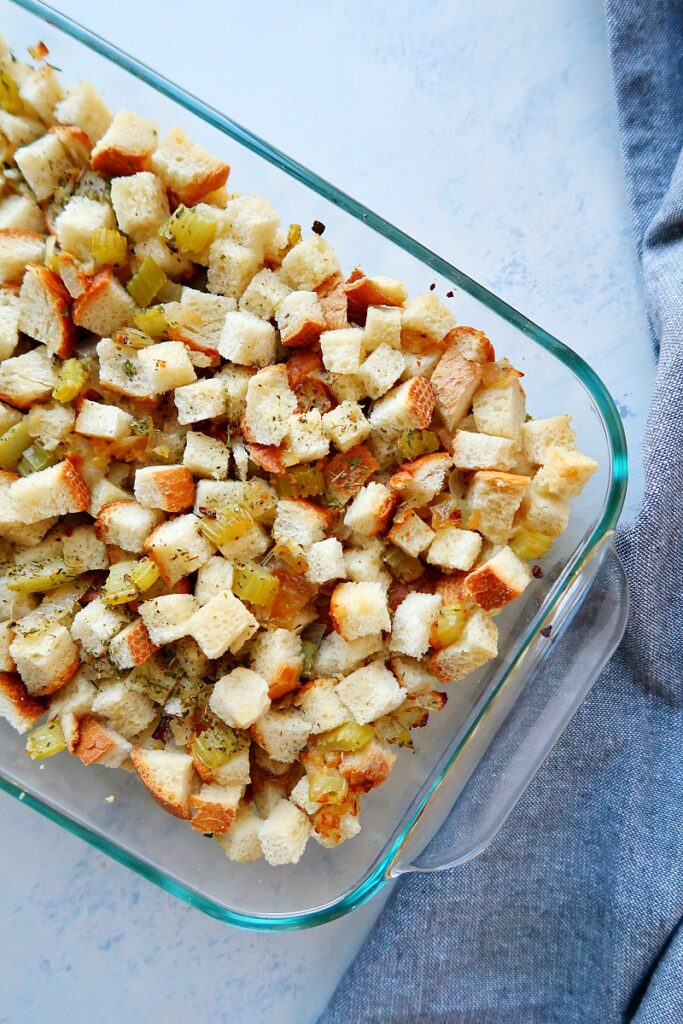 Vegan stuffing in a pan on a board.