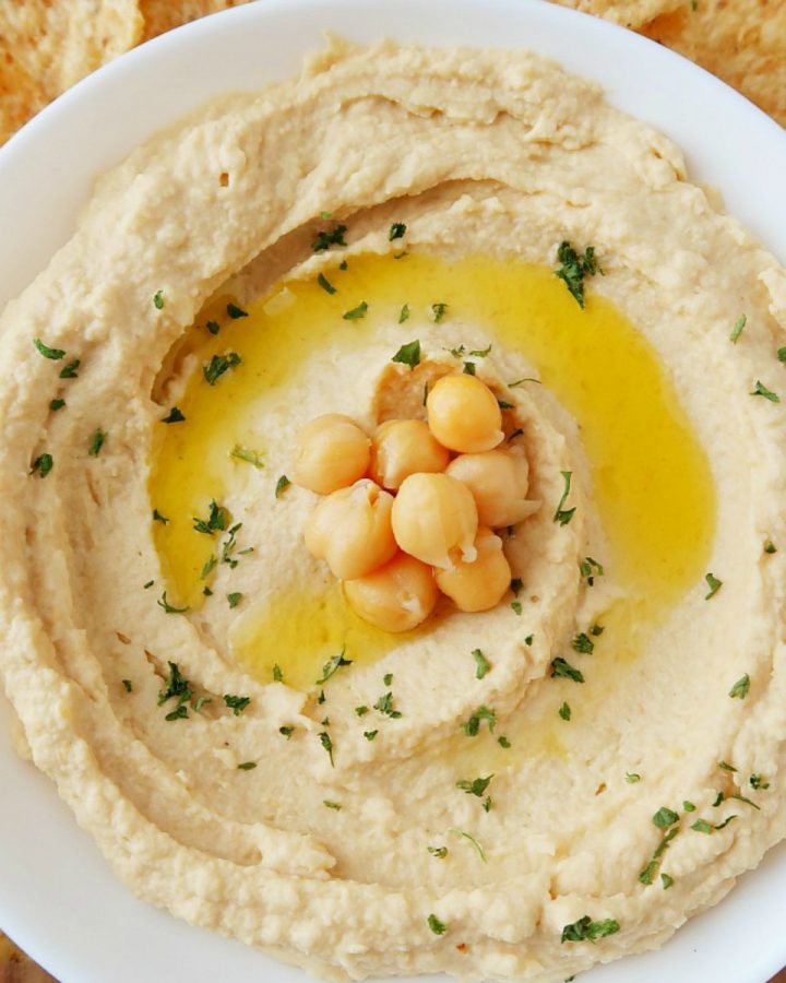 Hummus in a white bowl.